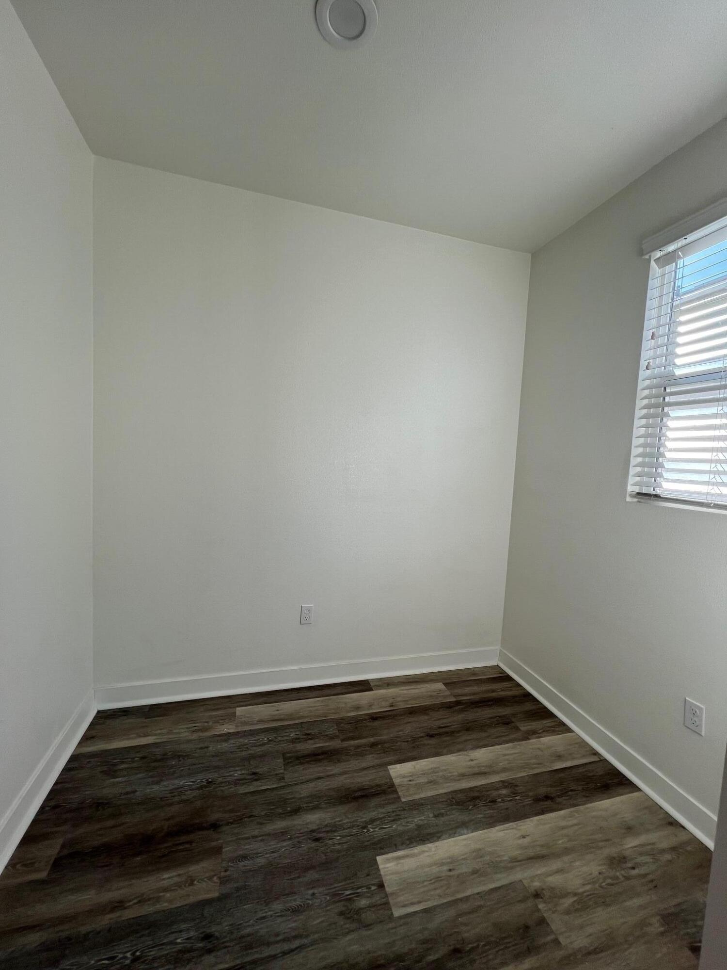 519 Bolinas Way, Unit 104 Goleta, CA 93117 - Photo 14 of 22 a view of wooden floor and cabinet in a room
