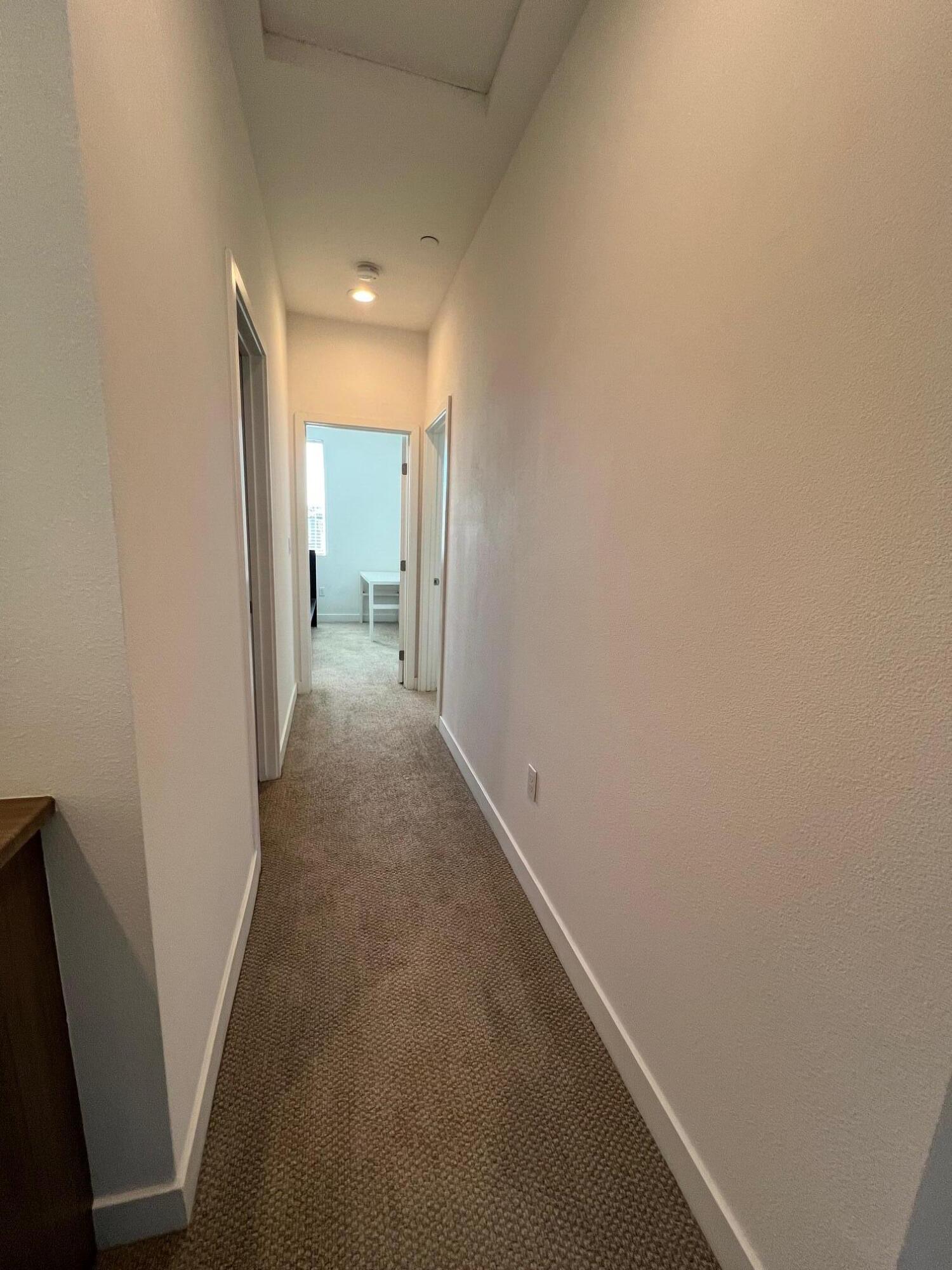 519 Bolinas Way, Unit 104 Goleta, CA 93117 - Photo 15 of 22 a view of a hallway with wooden floor
