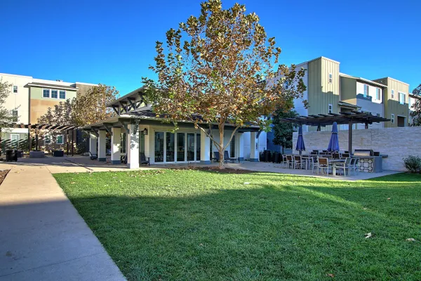 a view of a house with a yard porch and sitting area