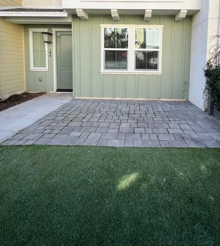 a view of front door of house and yard