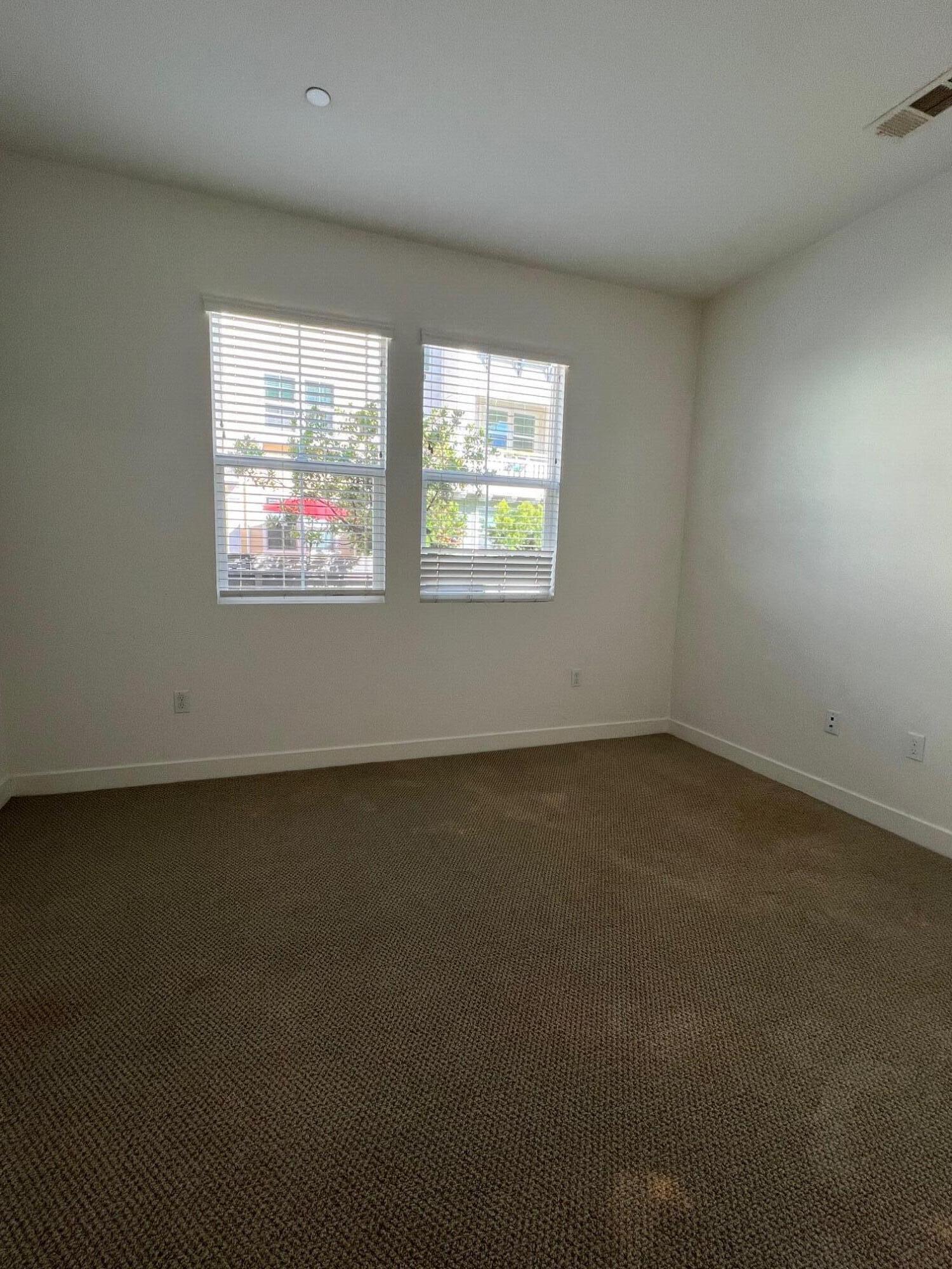 519 Bolinas Way, Unit 104 Goleta, CA 93117 - Photo 7 of 22 an empty room with windows