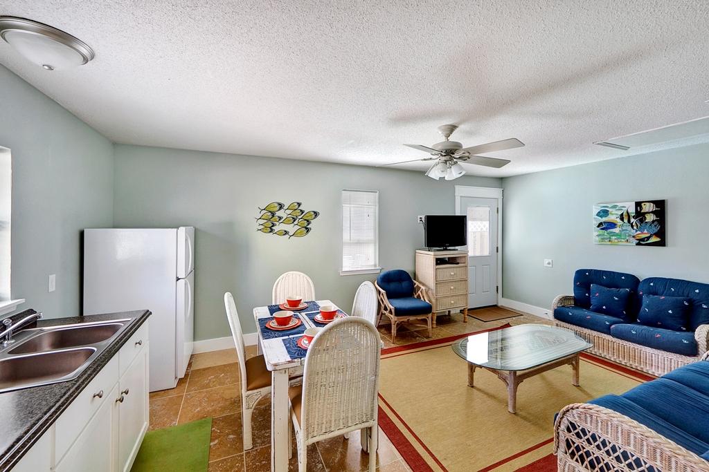68 Cobia Street Destin, FL 32541 - Photo 23 of 47 a living room with furniture and a flat screen tv