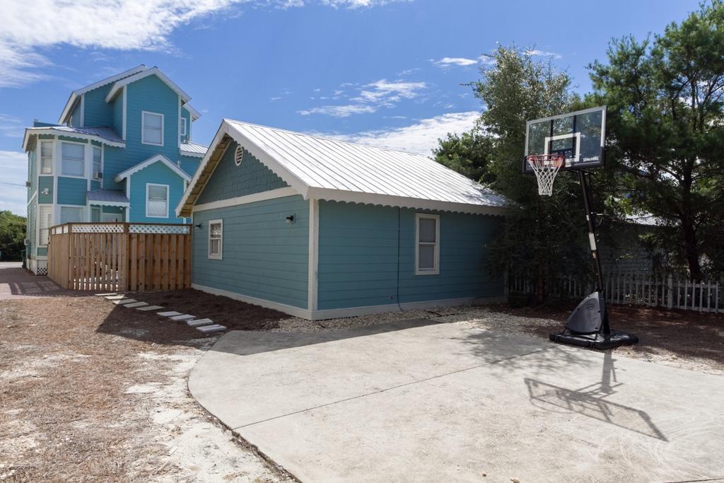 68 Cobia Street Destin, FL 32541 - Photo 25 of 47 a front view of a house with a yard and garage