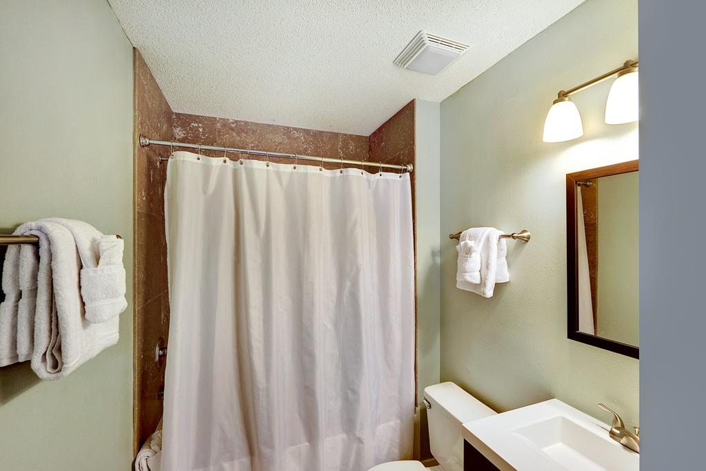 68 Cobia Street Destin, FL 32541 - Photo 27 of 47 a bathroom with a shower curtain and a sink