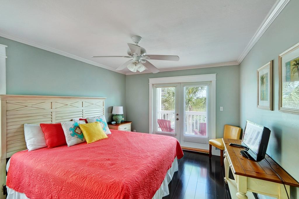 68 Cobia Street Destin, FL 32541 - Photo 36 of 47 a bedroom with a bed and wooden floor