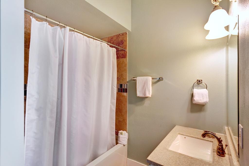 68 Cobia Street Destin, FL 32541 - Photo 41 of 47 a bathroom with a sink and mirror