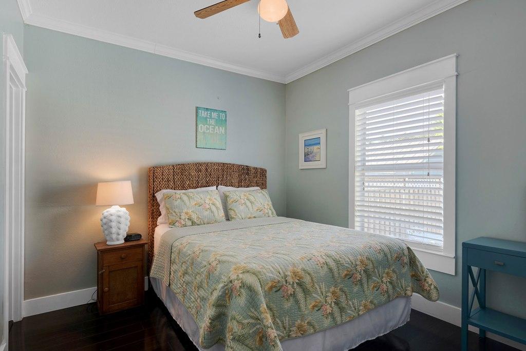 68 Cobia Street Destin, FL 32541 - Photo 46 of 47 a bed sitting in a bedroom next to a window and a chandelier