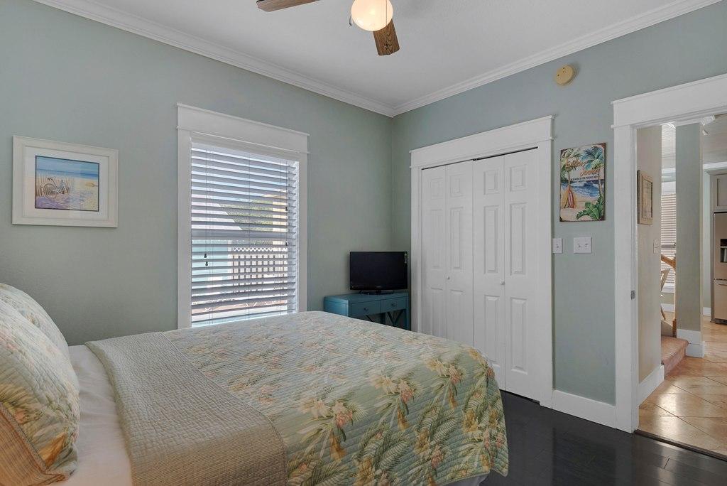 68 Cobia Street Destin, FL 32541 - Photo 47 of 47 a bedroom with a bed and a chandelier