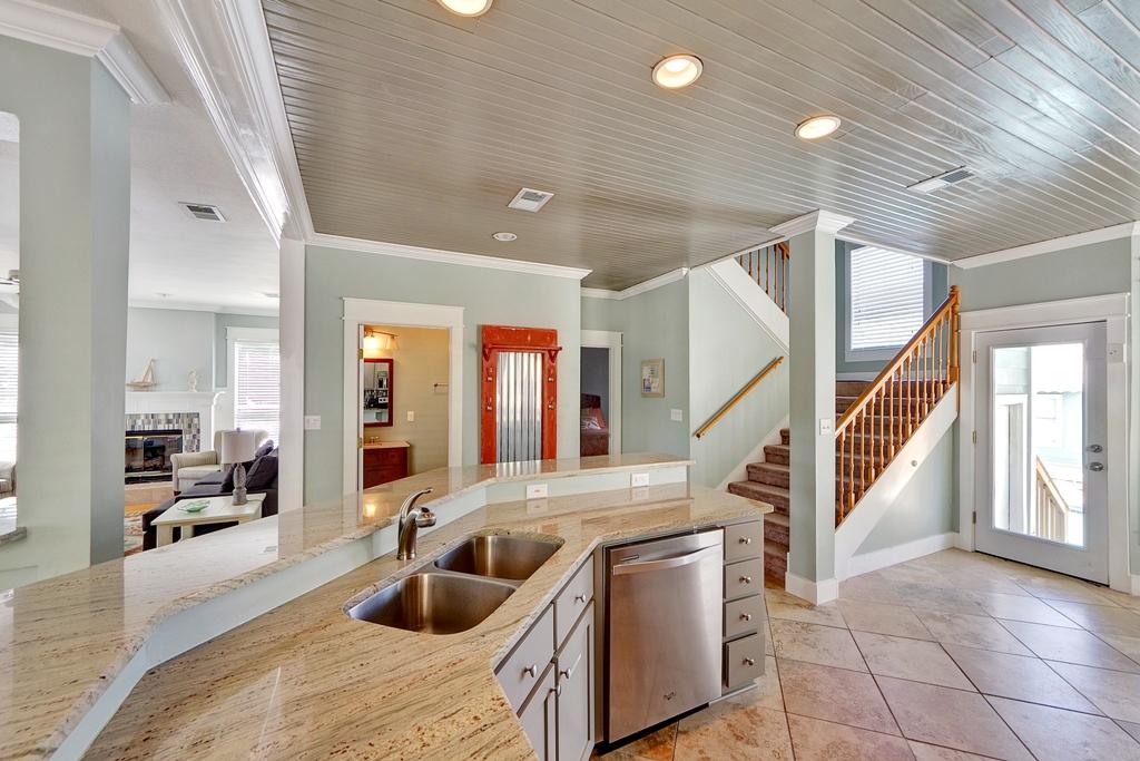 68 Cobia Street Destin, FL 32541 - Photo 8 of 47 a kitchen with stainless steel appliances granite countertop a sink and a refrigerator