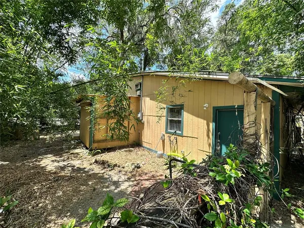 a view of a back yard of the house