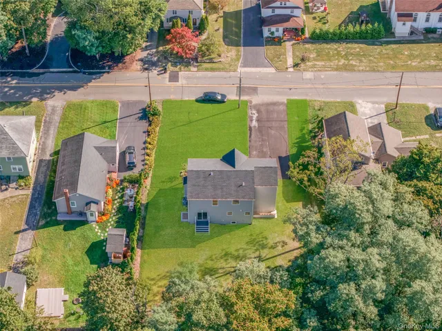 an aerial view of a house with a garden