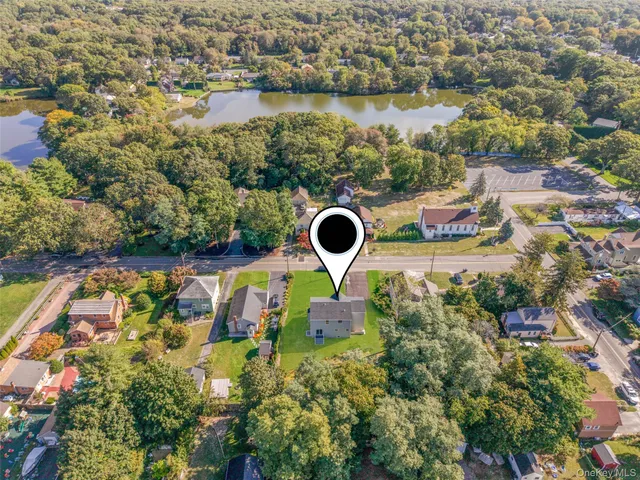 an aerial view of house with yard swimming pool and outdoor seating