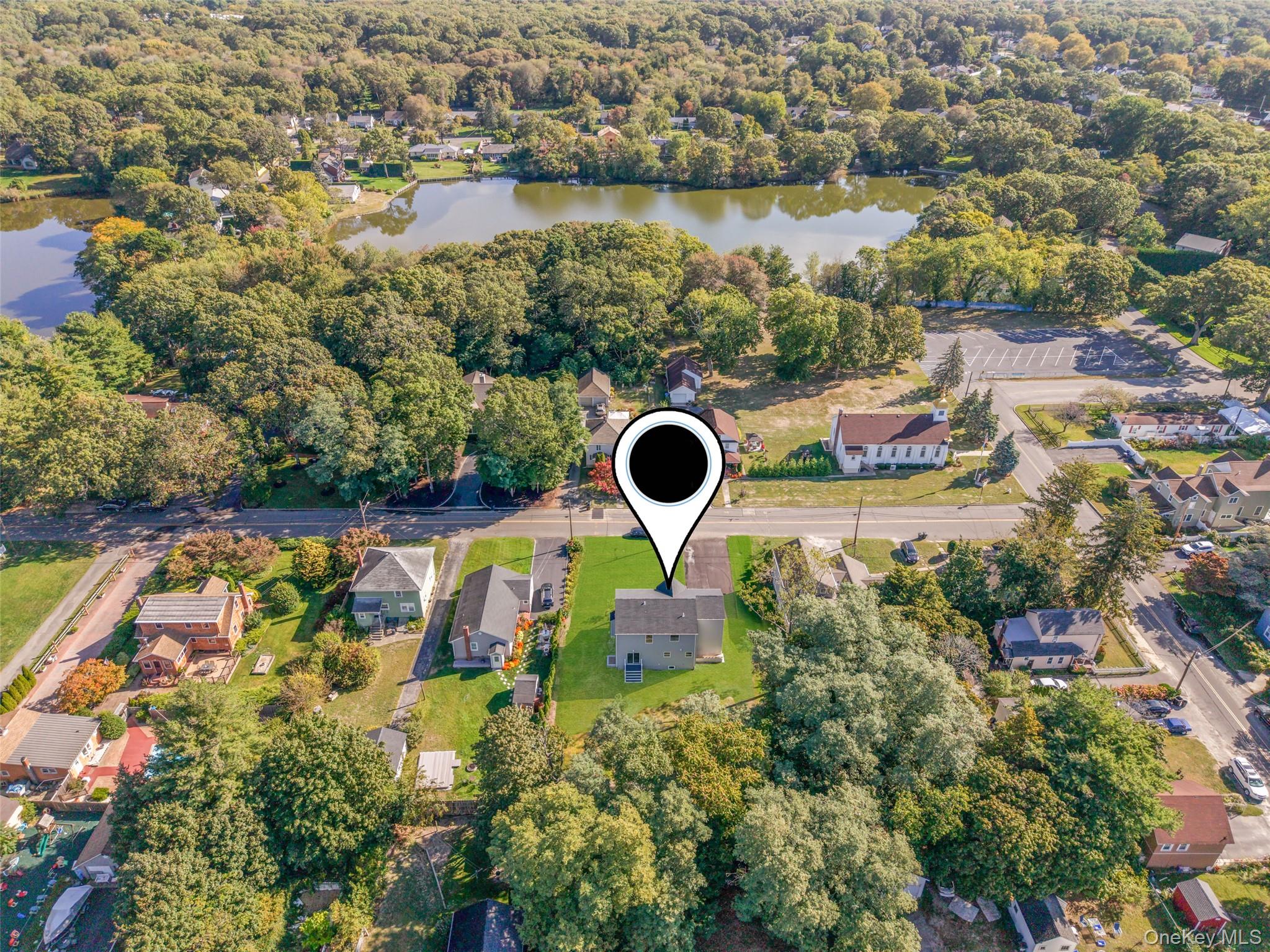 817 Pond View Road Riverhead, NY 11901 - Photo 13 of 36 an aerial view of house with yard swimming pool and outdoor seating