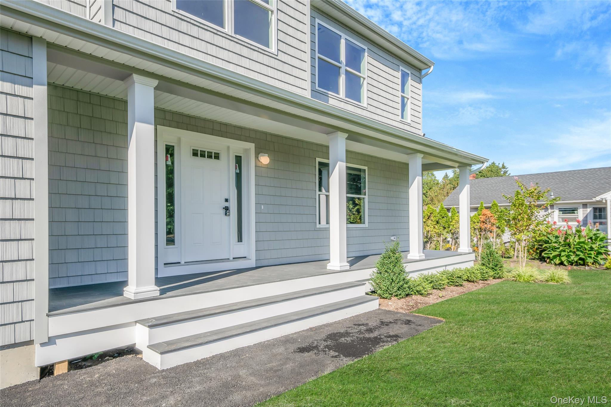 817 Pond View Road Riverhead, NY 11901 - Photo 15 of 36 a front view of a house with a yard