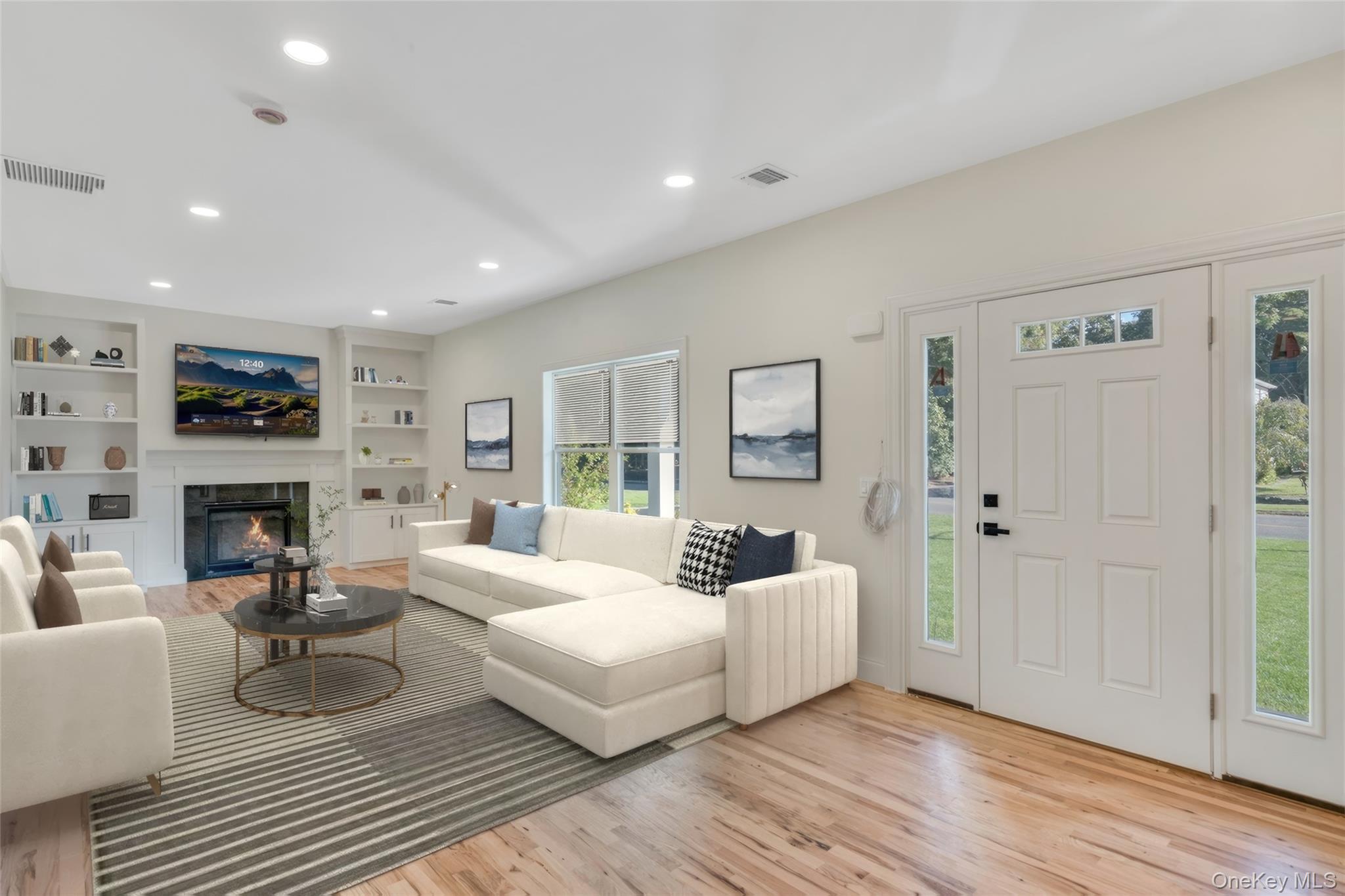 817 Pond View Road Riverhead, NY 11901 - Photo 16 of 36 a living room with furniture and a fireplace