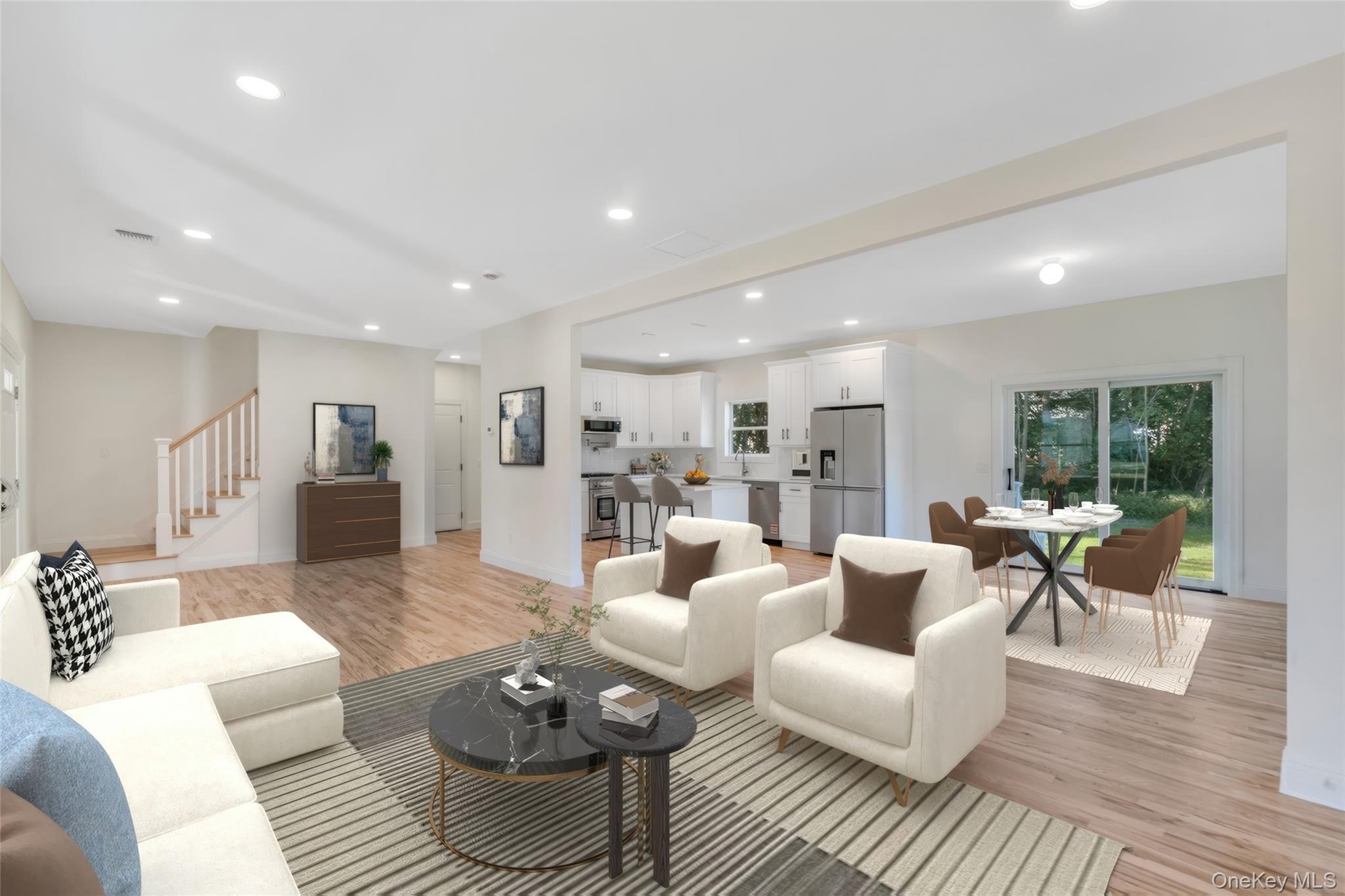 817 Pond View Road Riverhead, NY 11901 - Photo 17 of 36 a living room with furniture and a wooden floor