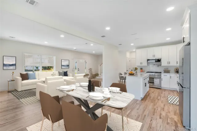 a dining room with furniture and window