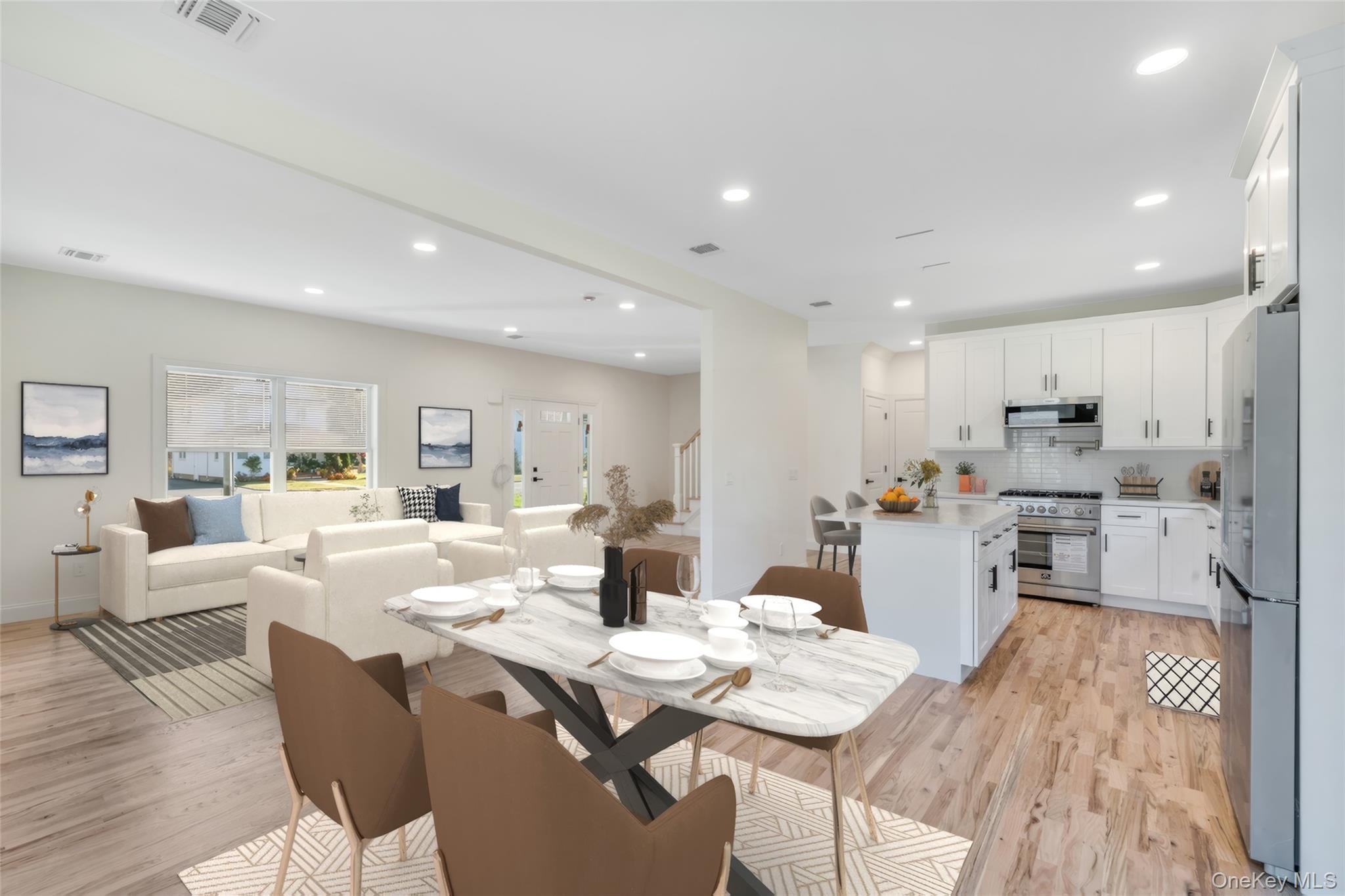 817 Pond View Road Riverhead, NY 11901 - Photo 18 of 36 a view of a dining room with furniture wooden floor and a chandelier