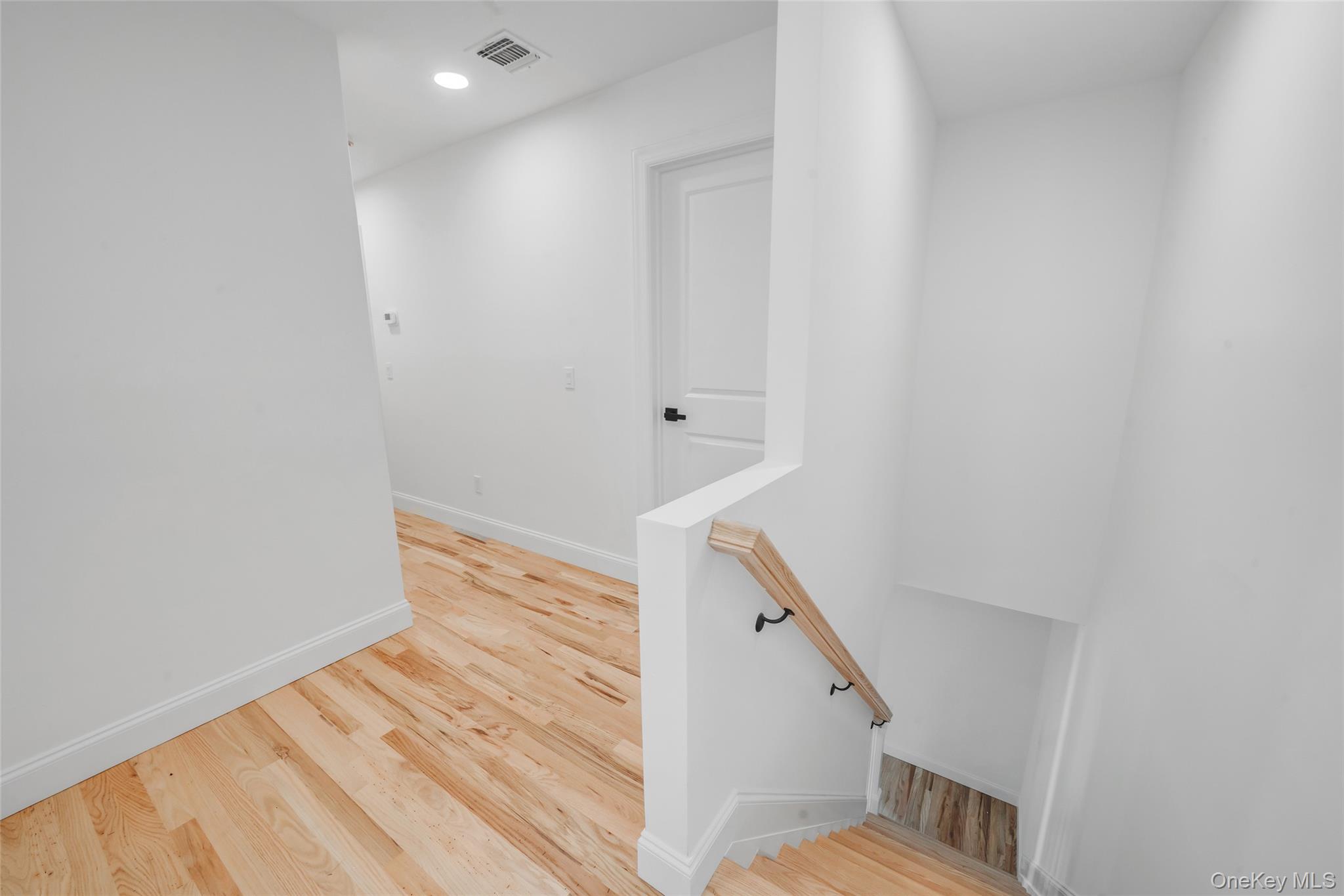 817 Pond View Road Riverhead, NY 11901 - Photo 25 of 36 a view of entryway with wooden floor