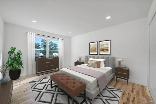 a bathroom with a sink a toilet and a large mirror