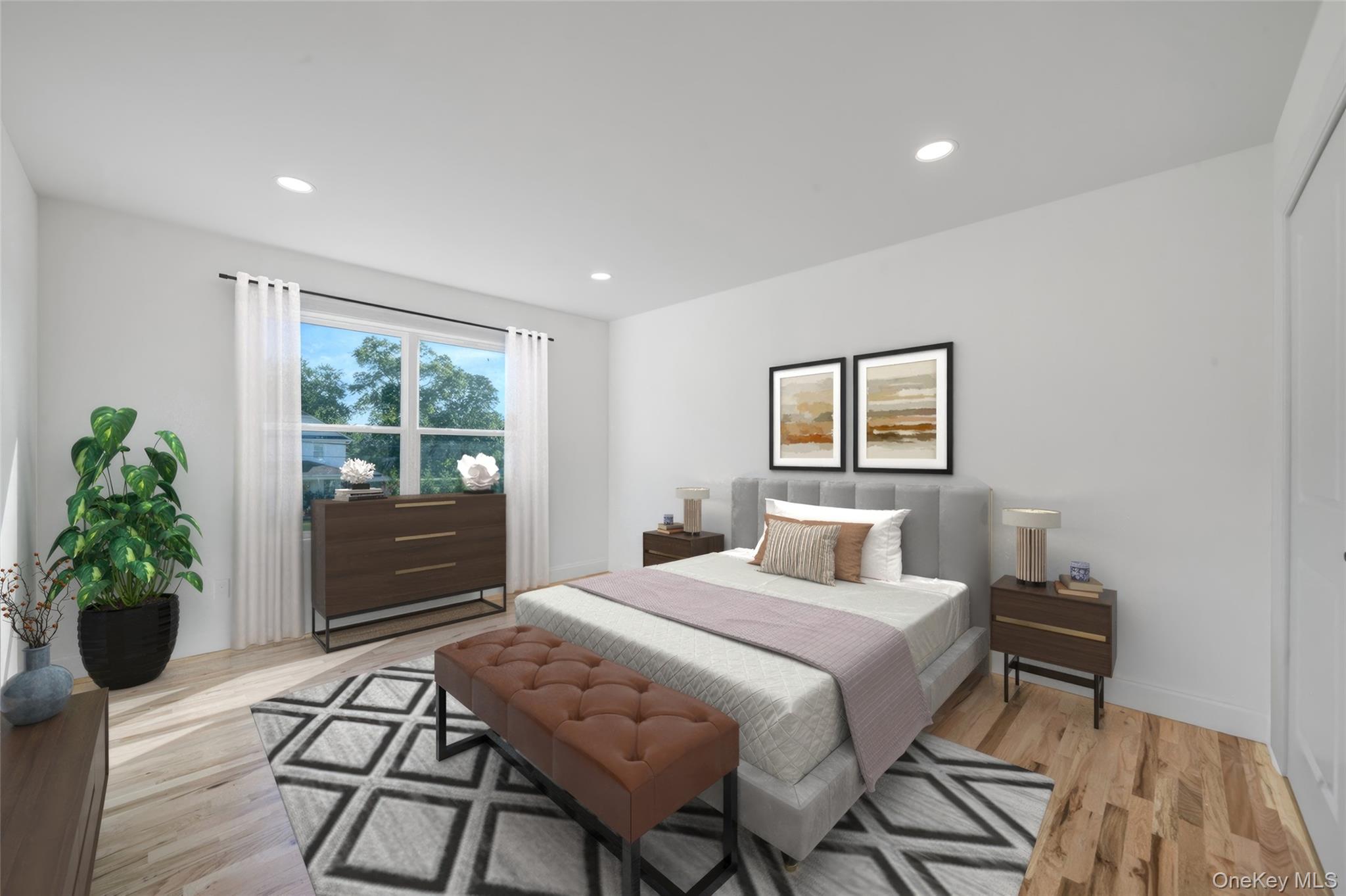 817 Pond View Road Riverhead, NY 11901 - Photo 28 of 36 a bedroom with a bed and a potted plant