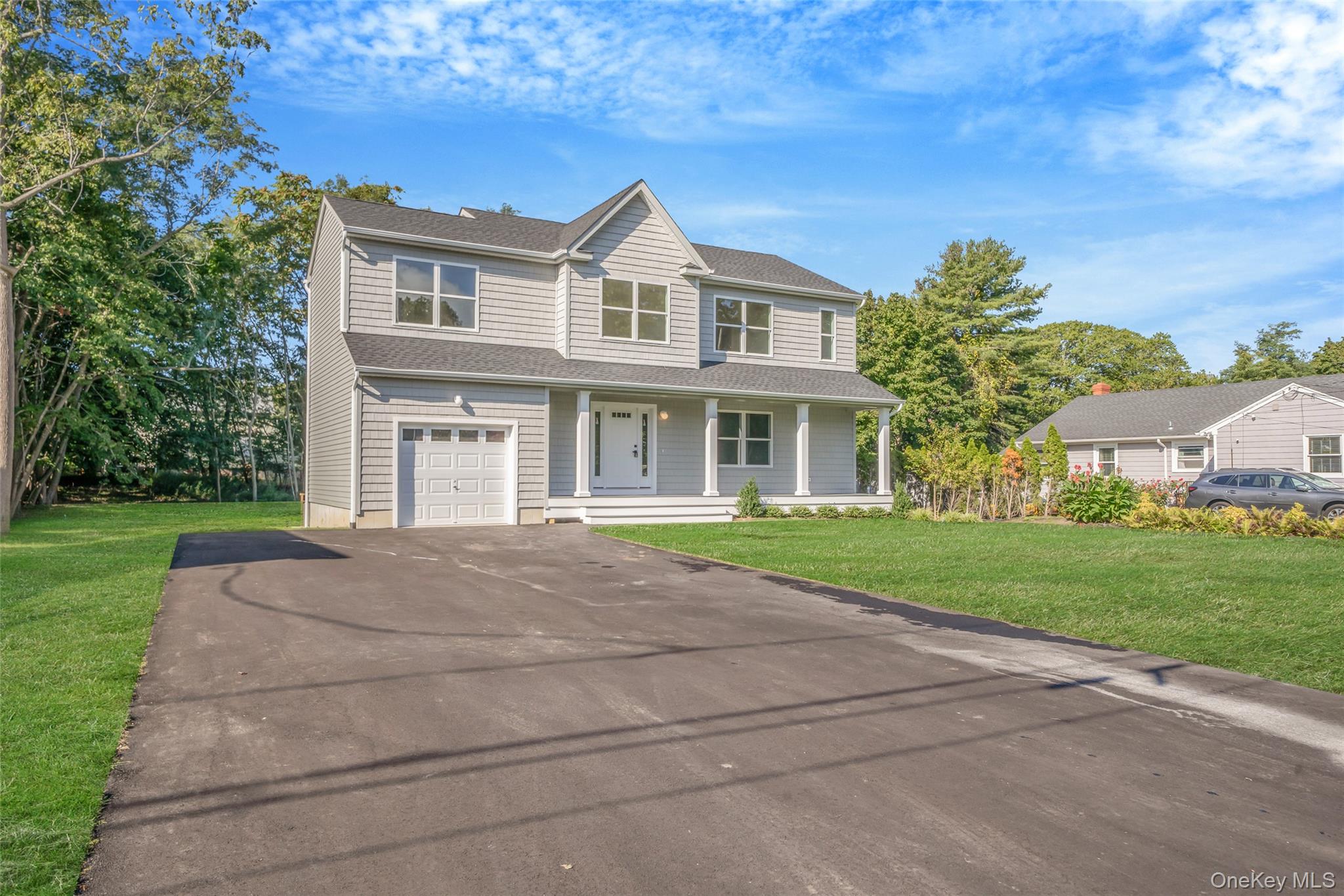 817 Pond View Road Riverhead, NY 11901 - Photo 3 of 36 front view of house with a yard