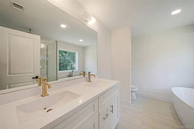 a bathroom with a bathtub and shower