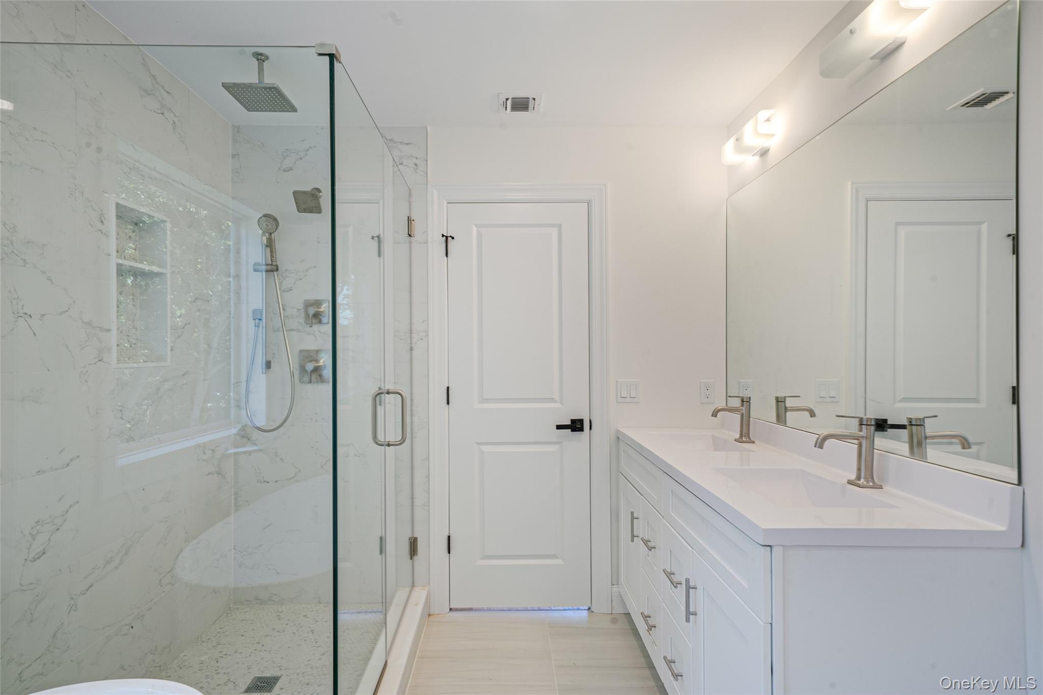 817 Pond View Road Riverhead, NY 11901 - Photo 33 of 36 a bathroom with a double vanity sink mirror and shower