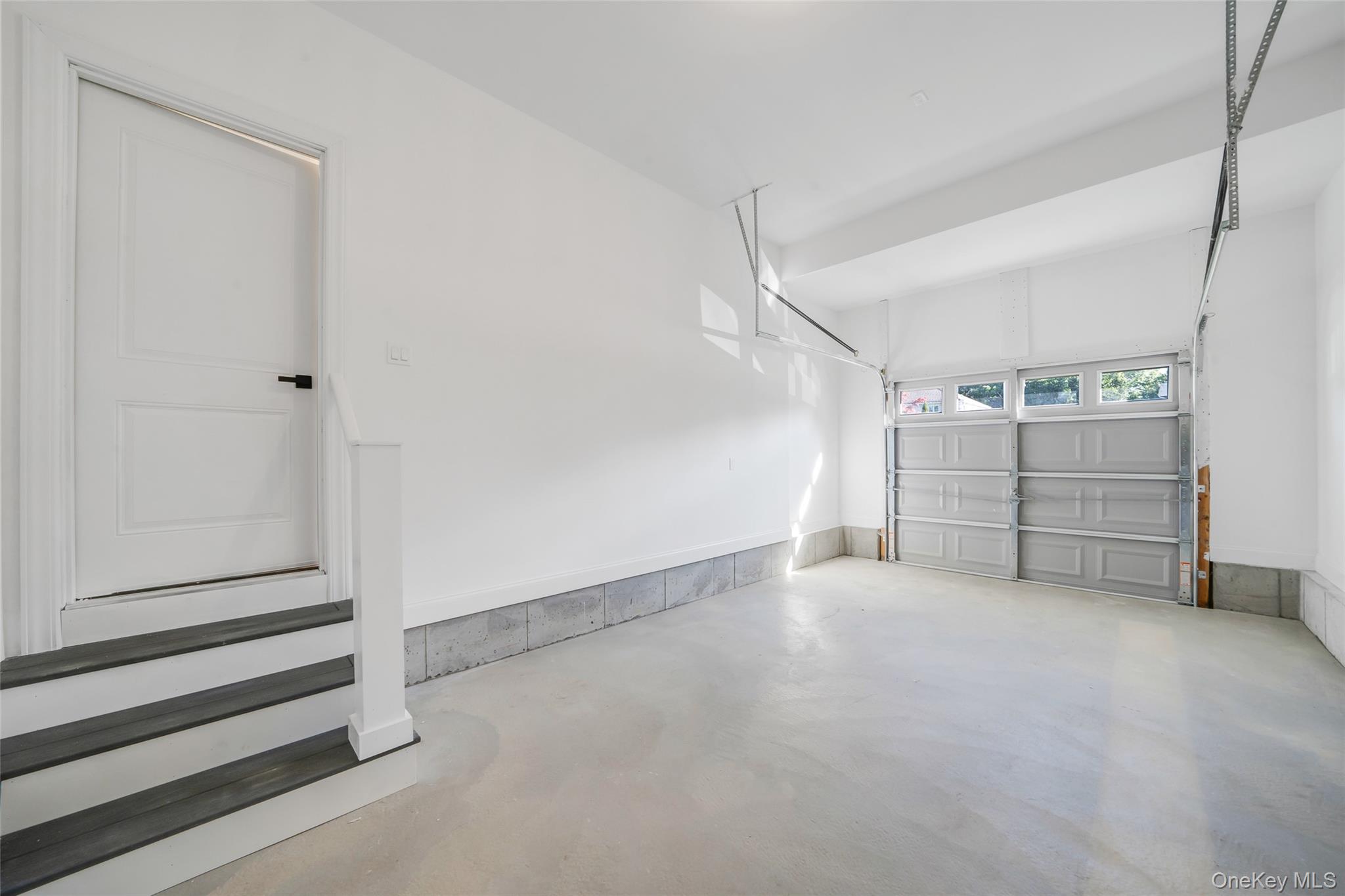 817 Pond View Road Riverhead, NY 11901 - Photo 35 of 36 a view of an empty room with cabinet and stairs