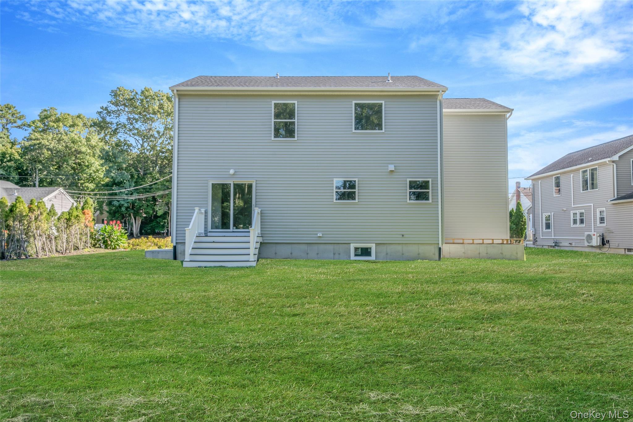 817 Pond View Road Riverhead, NY 11901 - Photo 6 of 36 a house that is sitting in the grass