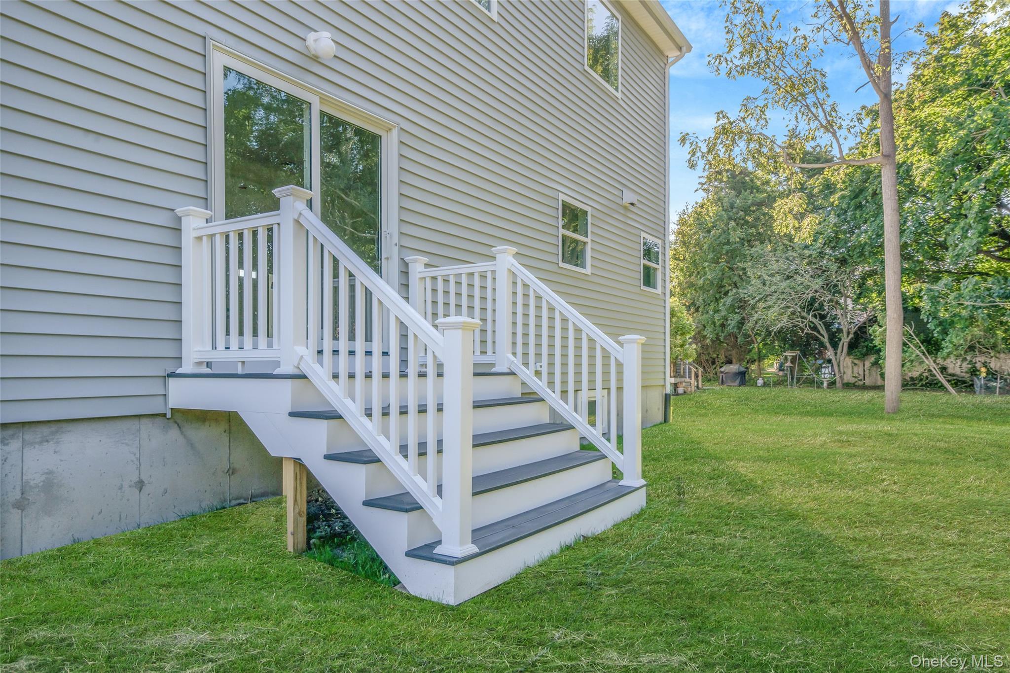 817 Pond View Road Riverhead, NY 11901 - Photo 8 of 36 a view of a house with a yard