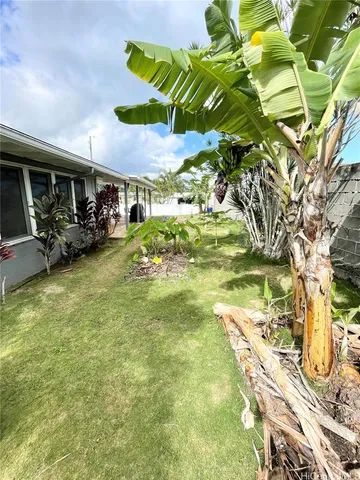 a view of a swimming pool with an outdoor seating area