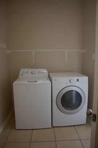 a view of an empty room with a cabinet
