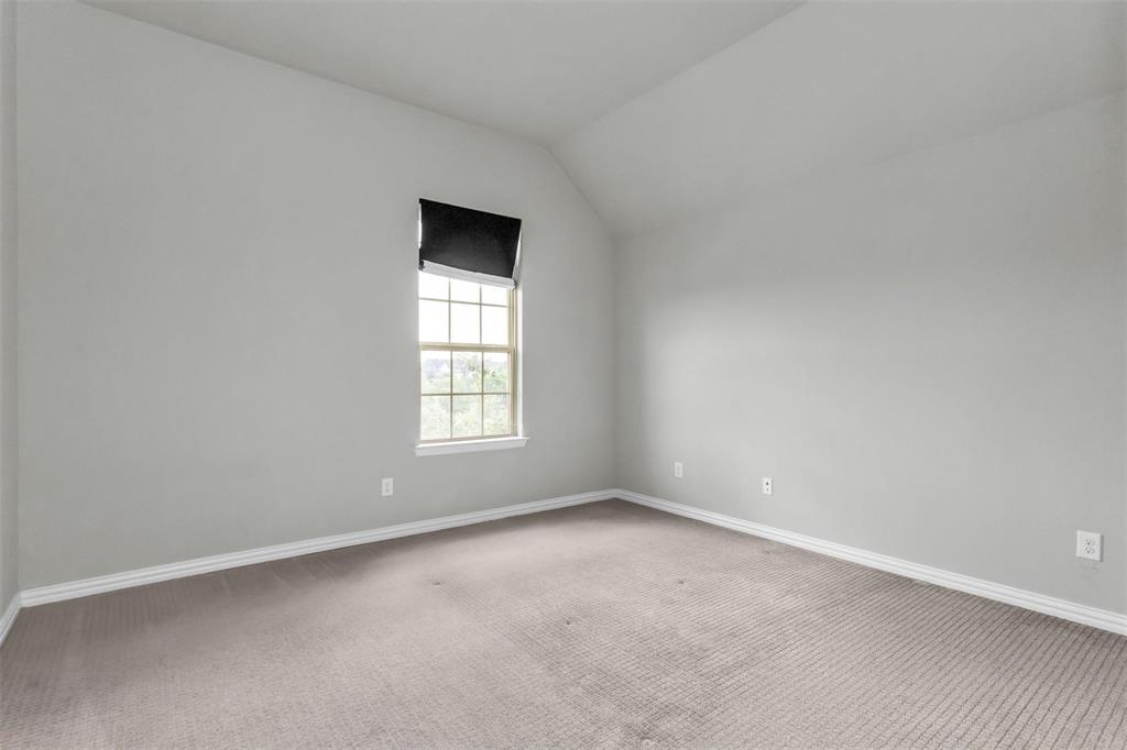 6333 Hall Road Frisco, TX 75034 - Photo 28 of 38 Neutral wall finish, carpeted flooring, window with sash, and sloped ceiling