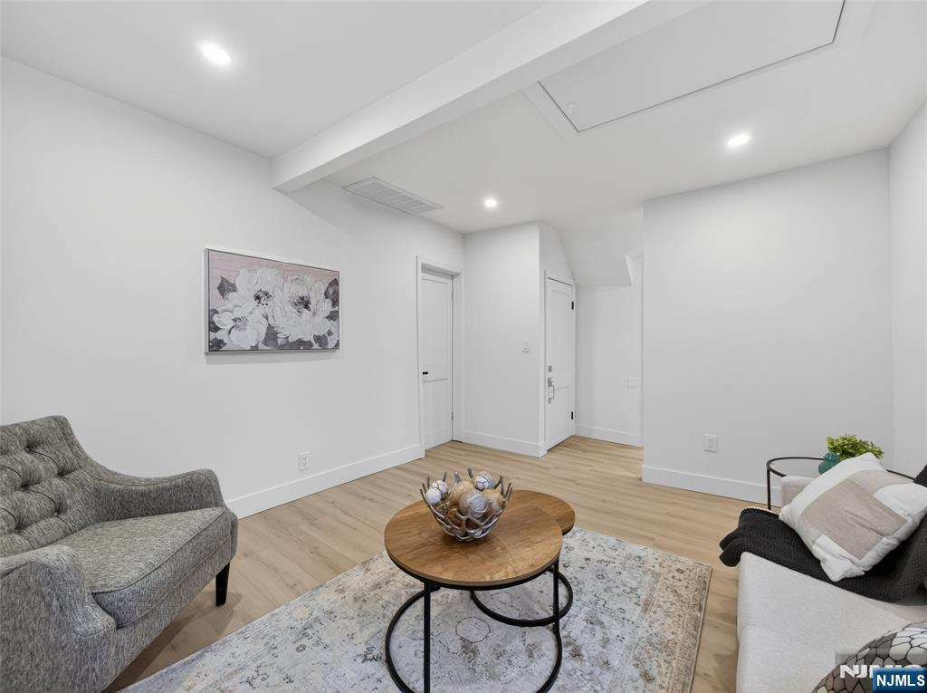 114 Colony Avenue, Unit 2 Park Ridge, NJ 07656 - Photo 7 of 12 a living room with furniture and a rug