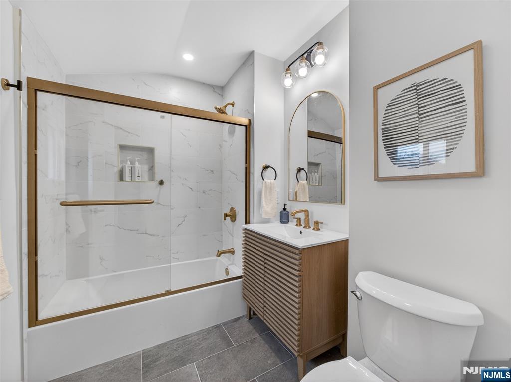 114 Colony Avenue, Unit 2 Park Ridge, NJ 07656 - Photo 10 of 12 a bathroom with a bathtub a shower a toilet and sink