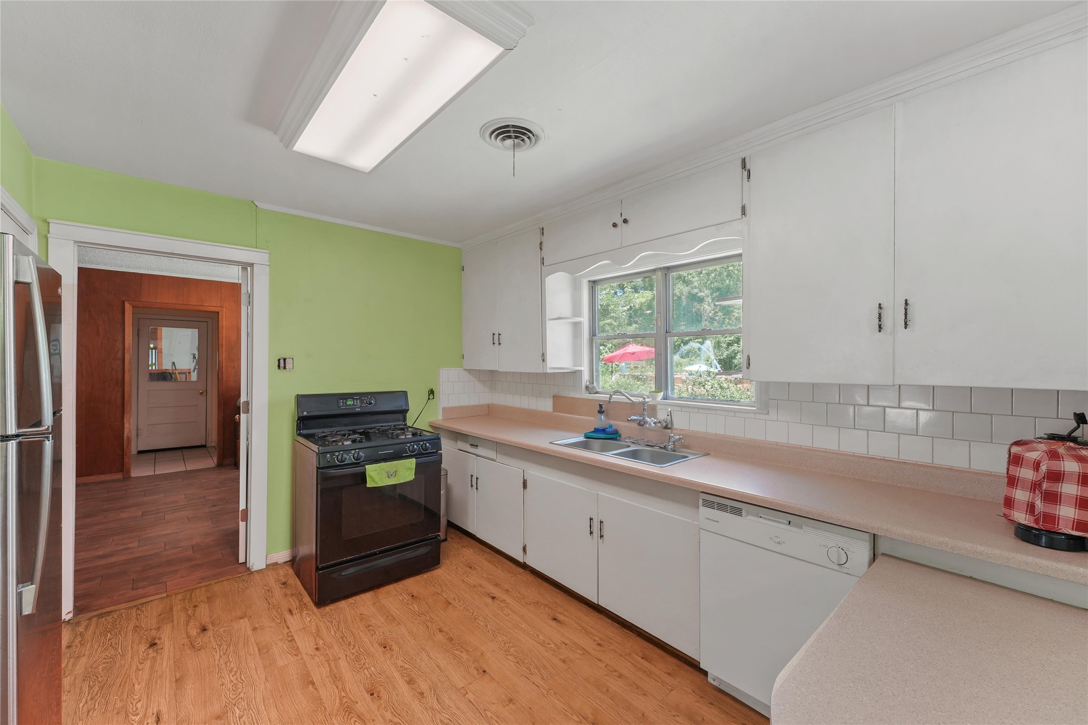 2702 Mckinney Road Baytown, TX 77520 - Photo 11 of 22 a kitchen with a sink and cabinets