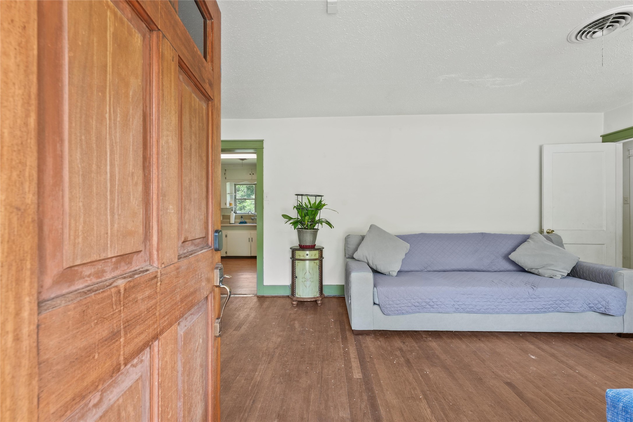 2702 Mckinney Road Baytown, TX 77520 - Photo 21 of 22 a living room with furniture and wooden floor