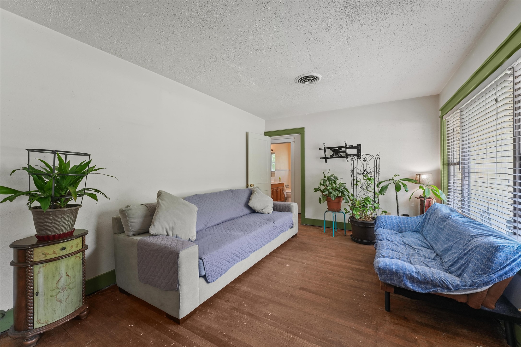 2702 Mckinney Road Baytown, TX 77520 - Photo 7 of 22 a living room with furniture and a potted plant