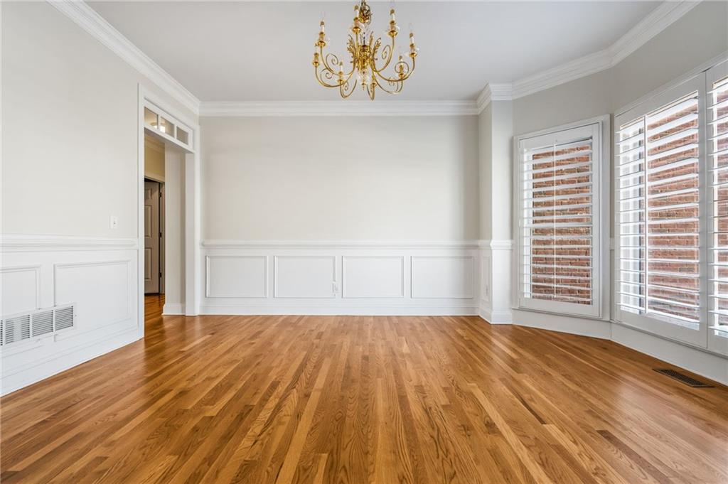2013 Cockrell Run Northwest Kennesaw, GA 30152 - Photo 12 of 69 a view of an empty room with wooden floor and a window