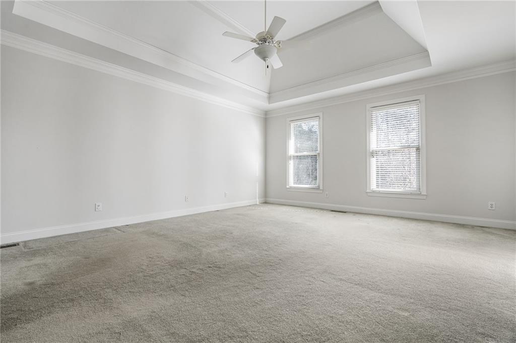 2013 Cockrell Run Northwest Kennesaw, GA 30152 - Photo 28 of 69 an empty room with windows and ceiling fan