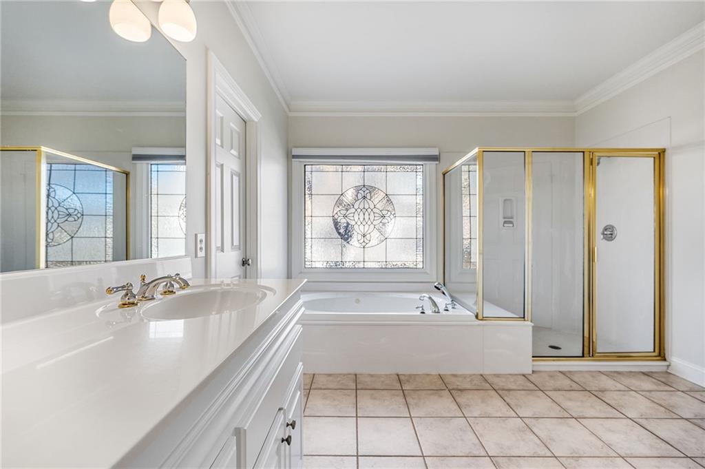 2013 Cockrell Run Northwest Kennesaw, GA 30152 - Photo 33 of 69 a spacious bathroom with a tub shower and sink