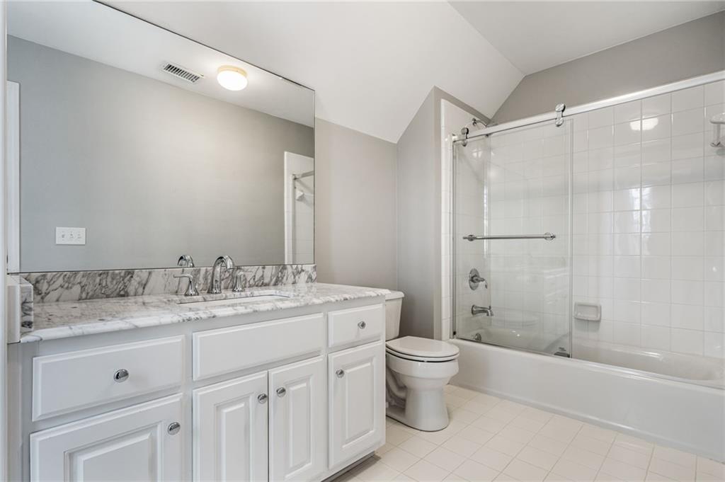 2013 Cockrell Run Northwest Kennesaw, GA 30152 - Photo 37 of 69 a bathroom with a granite countertop sink toilet and shower