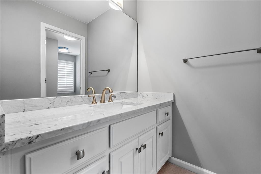 2013 Cockrell Run Northwest Kennesaw, GA 30152 - Photo 40 of 69 a bathroom with a granite countertop sink and a mirror