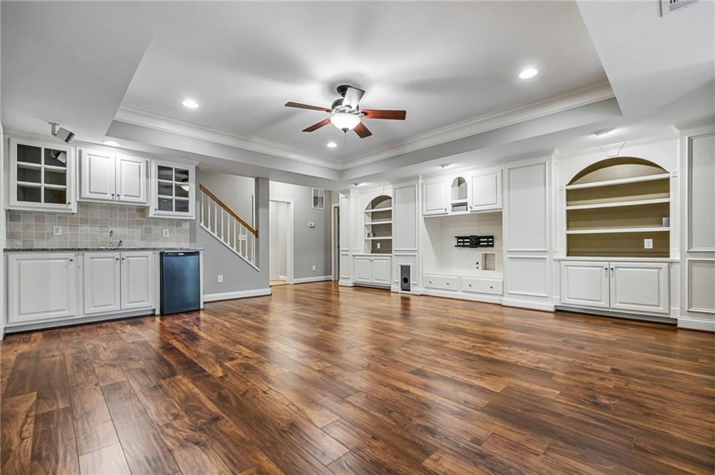 2013 Cockrell Run Northwest Kennesaw, GA 30152 - Photo 4 of 69 a view of a kitchen with wooden floor and a ceiling fan