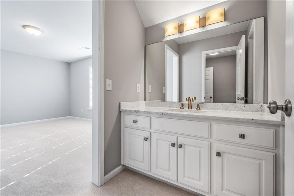 2013 Cockrell Run Northwest Kennesaw, GA 30152 - Photo 41 of 69 a bathroom with a sink and a mirror