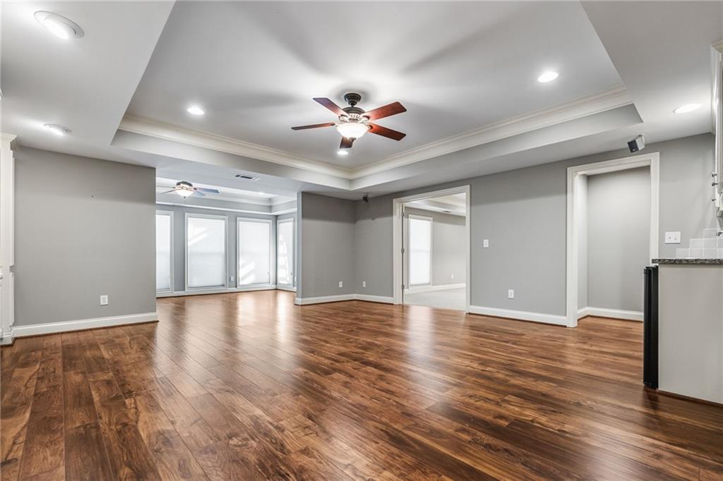 2013 Cockrell Run Northwest Kennesaw, GA 30152 - Photo 44 of 69 a view of an empty room with window and wooden floor