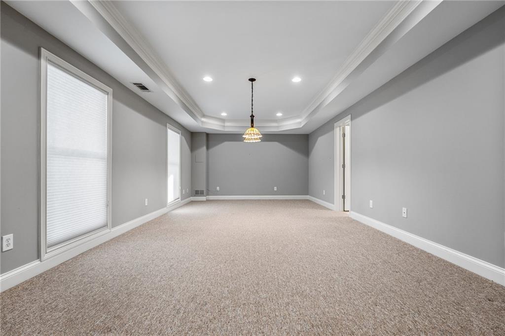 2013 Cockrell Run Northwest Kennesaw, GA 30152 - Photo 46 of 69 en empty room with windows and ceiling fan