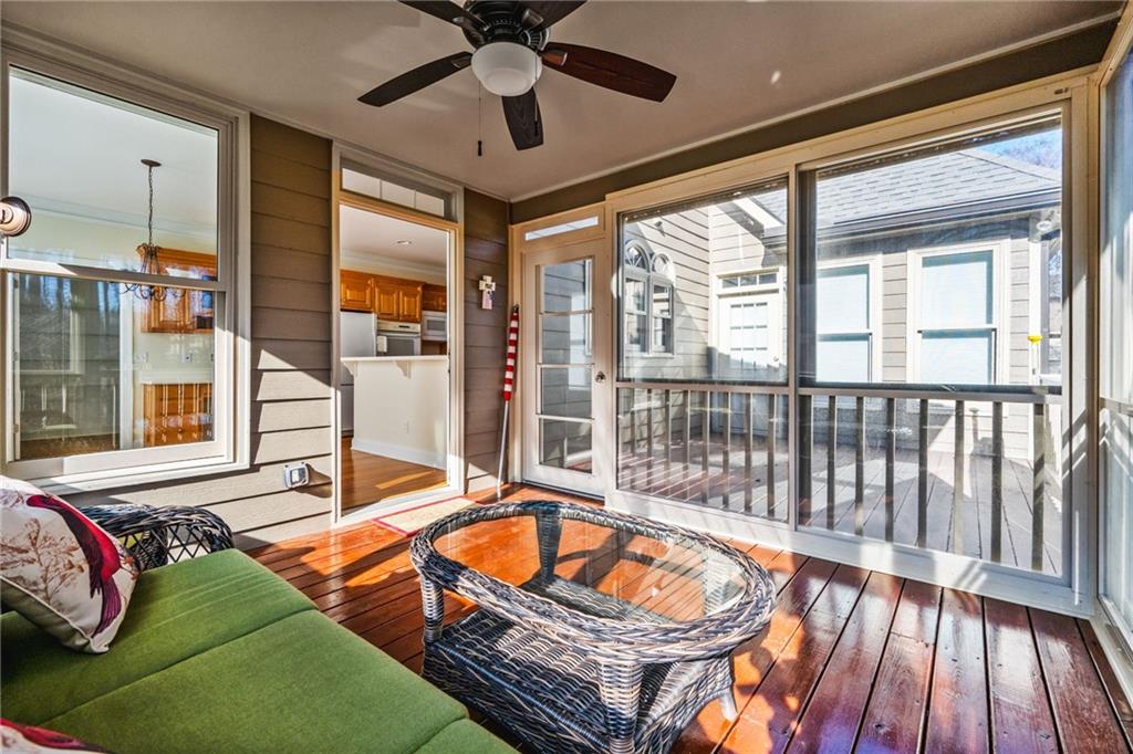 2013 Cockrell Run Northwest Kennesaw, GA 30152 - Photo 54 of 69 a living room with blue floor to ceiling windows and a flat screen tv