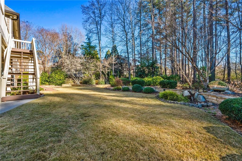 2013 Cockrell Run Northwest Kennesaw, GA 30152 - Photo 6 of 69 a view of a yard with plants and trees